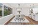 Bright dining room featuring contemporary lighting, modern furnishings, and large windows with natural light at 1849 S Columbia Place, Decatur, GA 30032