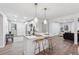 Bright kitchen featuring a breakfast bar, modern appliances, and open layout flowing into the living area at 1849 S Columbia Place, Decatur, GA 30032