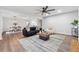 Spacious living room featuring modern furnishings, light hardwood floors, and an open-concept design at 1849 S Columbia Place, Decatur, GA 30032