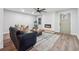 Cozy living room with a modern fireplace and hardwood flooring; perfect for relaxing or entertaining at 1849 S Columbia Place, Decatur, GA 30032