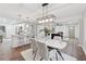 Open-concept living space featuring dining area, kitchen, and cozy living room with modern finishes and natural light at 1849 S Columbia Place, Decatur, GA 30032