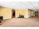 Spacious carpeted basement area offering ample room for recreation and fitness equipment at 4048 Sandy Branch Ne Dr, Buford, GA 30519