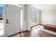 Inviting entryway with hardwood floors and natural light from sidelight window at 4048 Sandy Branch Ne Dr, Buford, GA 30519