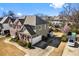 Attractive home showcasing the side elevation, manicured lawn, and a convenient two-car garage at 4048 Sandy Branch Ne Dr, Buford, GA 30519