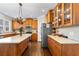 Spacious kitchen featuring stainless steel appliances, shaker cabinets and granite countertops at 4048 Sandy Branch Ne Dr, Buford, GA 30519