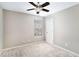 Neutral bedroom with a ceiling fan and a window providing natural light at 4283 Brighton Nw Way, Kennesaw, GA 30144