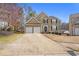 Charming two-story home features a two-car garage, manicured landscaping, and a classic architectural design at 4283 Brighton Nw Way, Kennesaw, GA 30144