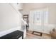 Bright Foyer with hardwood flooring and natural light with a staircase and glass decorated front door at 4283 Brighton Nw Way, Kennesaw, GA 30144