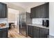 Kitchen features stainless appliances, granite countertops and dark wood cabinetry at 4283 Brighton Nw Way, Kennesaw, GA 30144