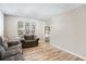 Inviting living room features wood floors, large windows, and ample natural light at 4283 Brighton Nw Way, Kennesaw, GA 30144