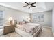 Bright main bedroom features a tray ceiling, large windows, neutral colors, and plush carpeting at 4283 Brighton Nw Way, Kennesaw, GA 30144