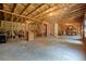 Unfinished basement featuring exposed insulation, wooden framing and concrete floor ready for customization at 66 Snowdon Way, Villa Rica, GA 30180