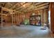 Unfinished basement provides a blank canvas, featuring insulation, wooden beams, and concrete floor at 66 Snowdon Way, Villa Rica, GA 30180