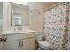 Neat bathroom with white fixtures, neutral color scheme, and patterned shower curtain at 66 Snowdon Way, Villa Rica, GA 30180