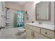 Bright bathroom with white vanity, a tub, and shower combo at 66 Snowdon Way, Villa Rica, GA 30180