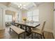 Elegant dining area featuring a modern table, upholstered chairs, and lots of natural light at 66 Snowdon Way, Villa Rica, GA 30180