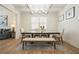 Elegant dining room featuring a wooden table, upholstered chairs, and a stylish coffered ceiling with a modern chandelier at 66 Snowdon Way, Villa Rica, GA 30180