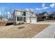 Charming two-story home with grey siding and white trim plus a two-car garage and long driveway at 66 Snowdon Way, Villa Rica, GA 30180