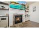 Close-up of the fireplace featuring stone surround, built-in shelving, and a mounted television for a modern touch at 66 Snowdon Way, Villa Rica, GA 30180