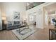 Bright and airy living room featuring high ceilings, hardwood floors, and a modern decor at 66 Snowdon Way, Villa Rica, GA 30180