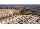 Overhead view of a residential area with houses on tree-lined streets, surrounded by green space at 2401 Day Break Way, Dacula, GA 30019