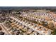 Aerial view of a suburban neighborhood with many single-Gathering homes and tree coverage at 2401 Day Break Way, Dacula, GA 30019