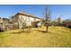 Exterior backyard featuring a covered patio and lush lawn, perfect for outdoor enjoyment at 2401 Day Break Way, Dacula, GA 30019