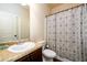 Functional bathroom featuring a vanity with sink and a shower with a patterned curtain at 2401 Day Break Way, Dacula, GA 30019