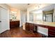 Bathroom featuring cherry wood cabinets, granite counters, and a separate shower at 2401 Day Break Way, Dacula, GA 30019