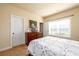 Comfortable bedroom featuring a dresser, window, and neutral colored walls at 2401 Day Break Way, Dacula, GA 30019