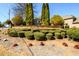 Inviting community entrance with brick signage, lush greenery, and manicured landscaping at 2401 Day Break Way, Dacula, GA 30019