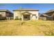 Backyard view of the home with covered patio, grill and outdoor furniture at 2401 Day Break Way, Dacula, GA 30019