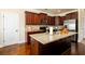 Modern kitchen featuring granite countertops, stainless steel appliances, and dark wood cabinetry at 2401 Day Break Way, Dacula, GA 30019