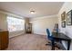 Bright home office featuring neutral walls, carpet, a window, and contemporary furniture at 2401 Day Break Way, Dacula, GA 30019