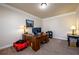 Comfortable carpeted office with crown molding, a desk, and neutral colored walls at 2401 Day Break Way, Dacula, GA 30019