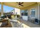 Covered patio features ceiling fan, assorted patio furniture, and outdoor cooking appliances at 2401 Day Break Way, Dacula, GA 30019