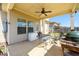 Outdoor patio featuring ceiling fan, grilling area, and fenced yard at 2401 Day Break Way, Dacula, GA 30019