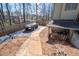 Backyard with a storage shed, a gravel area and stone walkway at 5034 Kingsbridge Pass, Powder Springs, GA 30127