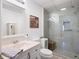 Bright bathroom featuring a glass walk-in shower and a modern vanity at 5034 Kingsbridge Pass, Powder Springs, GA 30127