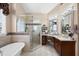 Beautiful bathroom with separate shower, soaking tub, and elegant vanity provides a spa-like experience at 5034 Kingsbridge Pass, Powder Springs, GA 30127