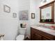 Stylish powder room featuring shiplap walls, dark vanity, and decorative accents at 5034 Kingsbridge Pass, Powder Springs, GA 30127