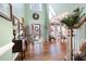 Bright foyer with hardwood floors, high ceilings, and elegant staircase leading to the upper level at 5034 Kingsbridge Pass, Powder Springs, GA 30127