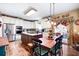 Bright kitchen with stainless steel appliances, custom cabinets, island, and adjacent dining table at 5034 Kingsbridge Pass, Powder Springs, GA 30127