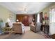 Cozy living room with warm colors, wood accents, and an open space layout for comfortable living at 5034 Kingsbridge Pass, Powder Springs, GA 30127