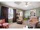 Relaxing living room with comfortable seating, lots of natural light, and neutral decor at 5034 Kingsbridge Pass, Powder Springs, GA 30127