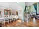 Elegant dining room with hardwood floors, chandelier, and ample natural light at 5034 Kingsbridge Pass, Powder Springs, GA 30127