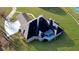Aerial view of a home showcasing its roof and the surrounding manicured lawn at 5690 Rutland Trce, Lithonia, GA 30058