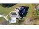 Overhead perspective of a house and its surrounding green lawn, complemented by the driveway at 5690 Rutland Trce, Lithonia, GA 30058