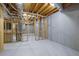 Unfinished basement with exposed beams and ductwork, offering potential for customization at 5690 Rutland Trce, Lithonia, GA 30058