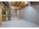 Unfinished basement showing framing, ceiling, water heater and concrete foundation at 5690 Rutland Trce, Lithonia, GA 30058